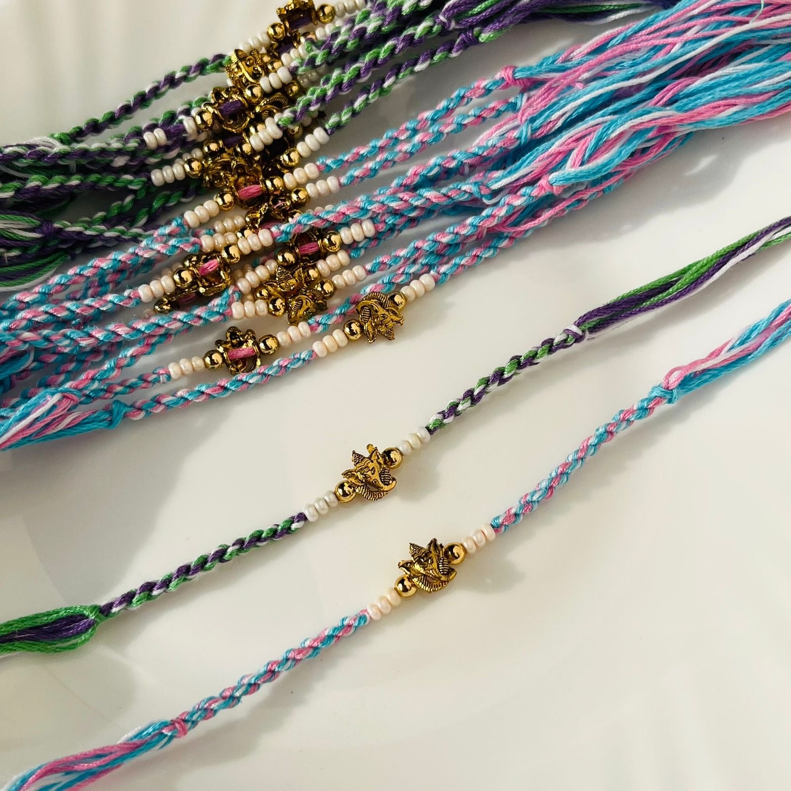 Pastel Thread Ganpati Rakhi